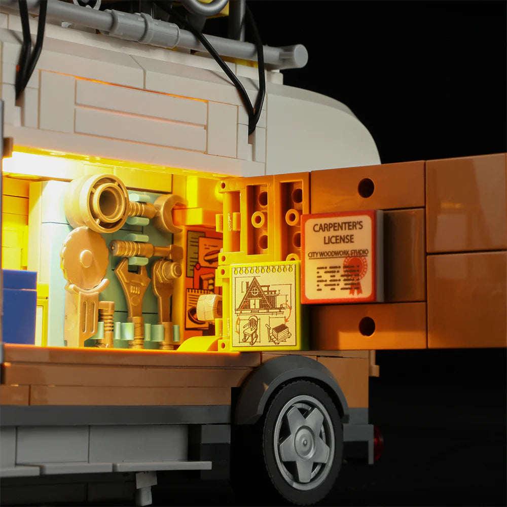 Lumibricks F9030 Carpentry Van close-up of illuminated tool board, carpenter’s license, and architectural drawing inside van