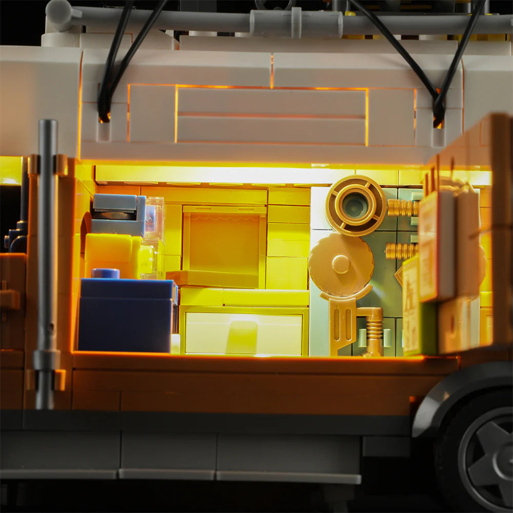 Lumibricks F9030 Carpentry Van close-up of illuminated interior with table saw, tool board, and woodworking equipment