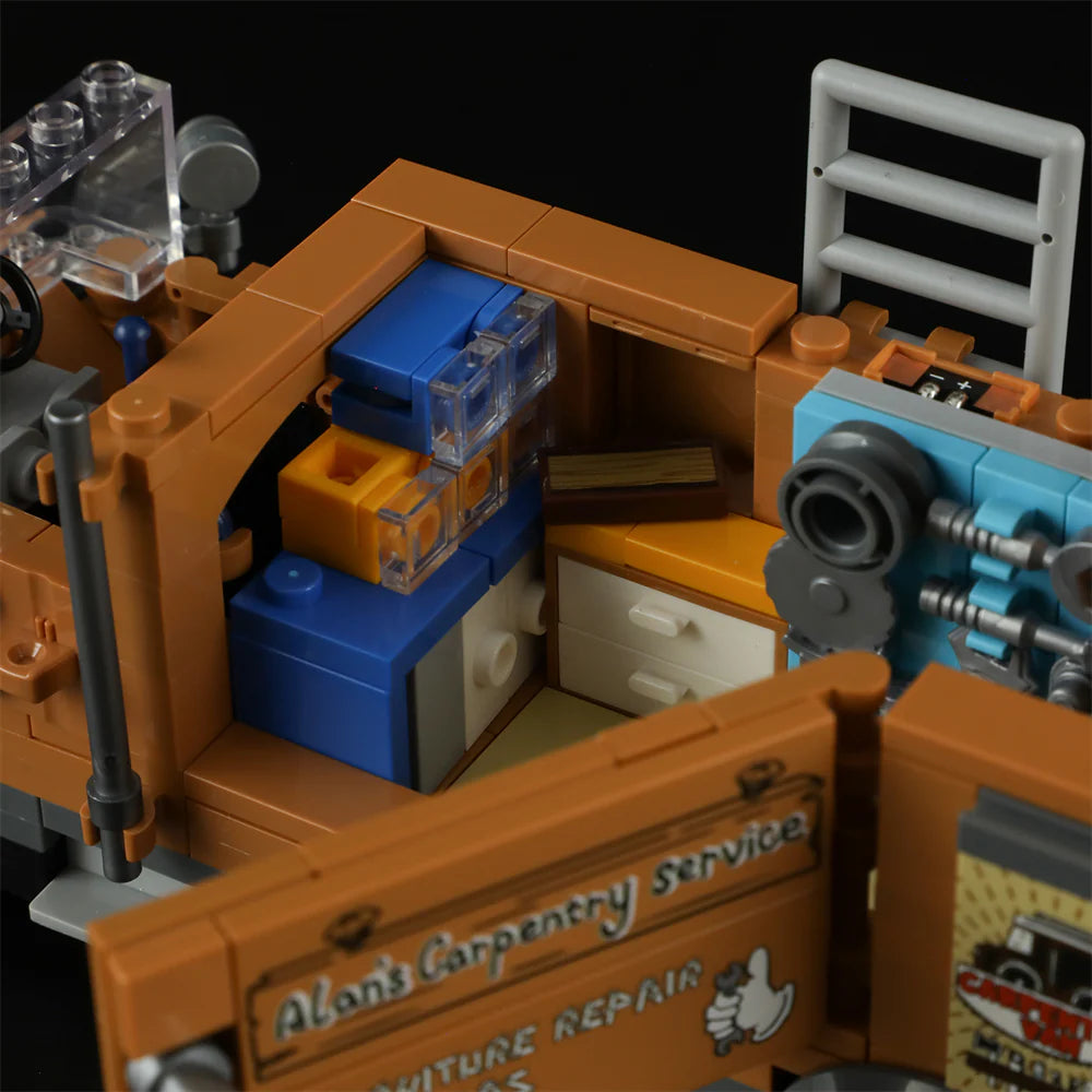 Lumibricks F9030 Carpentry Van interior with blue and orange storage drawers, tool board, and Alan’s Carpentry Service sign on door