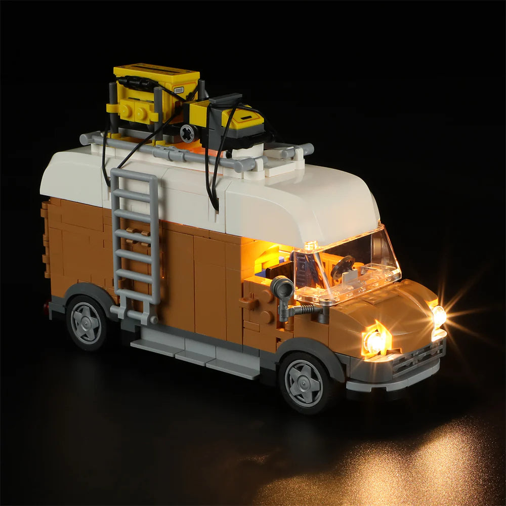 Lumibricks F9030 Carpentry Van at night with illuminated headlights, rooftop tools, and side ladder visible