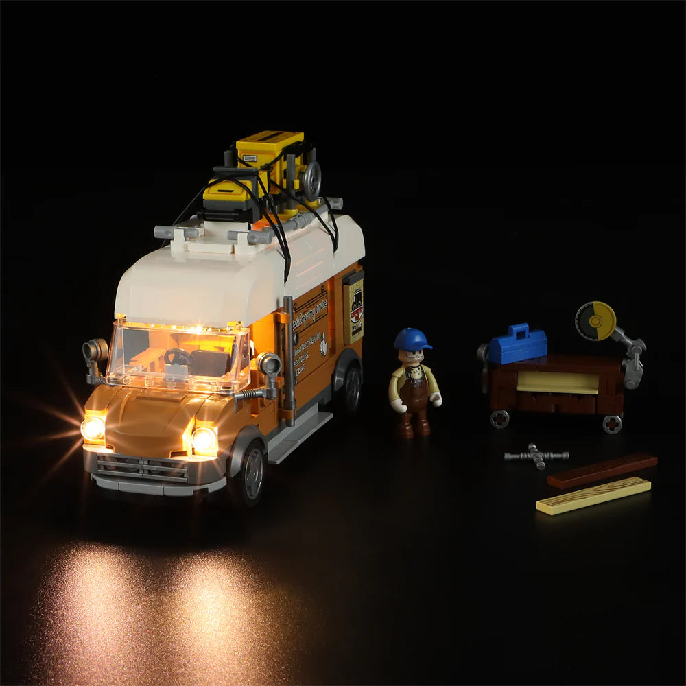 Lumibricks F9030 Carpentry Van front angle at night with glowing headlights, carpenter minifigure, and detailed tool cart