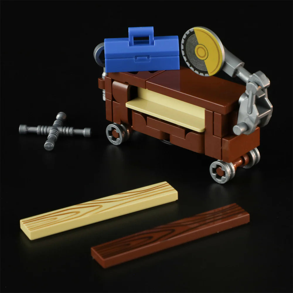 Lumibricks F9030 Carpentry Van close-up of brick-built table saw with circular blade, mobile tool box, and two wood planks