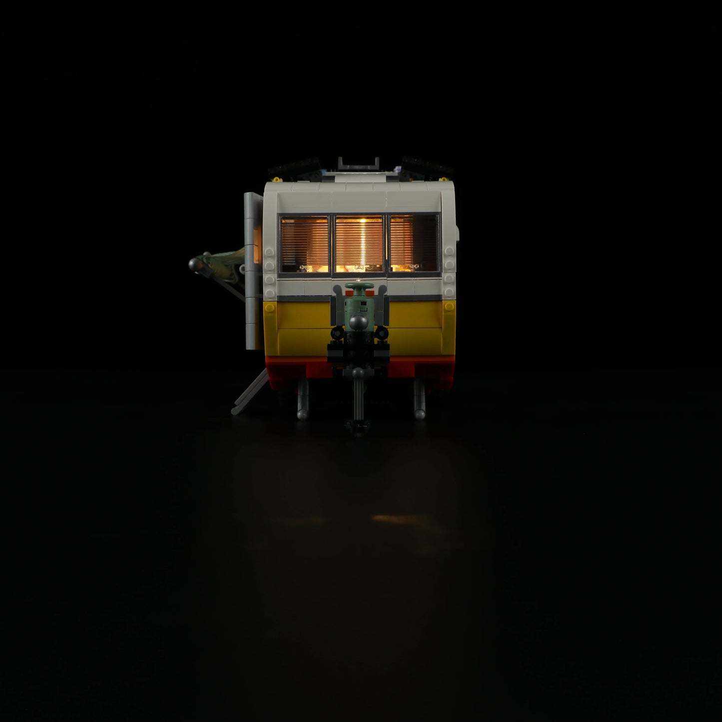 Lumibricks F9032 Travel Trailer rear night view with illuminated windows and detailed hitch assembly