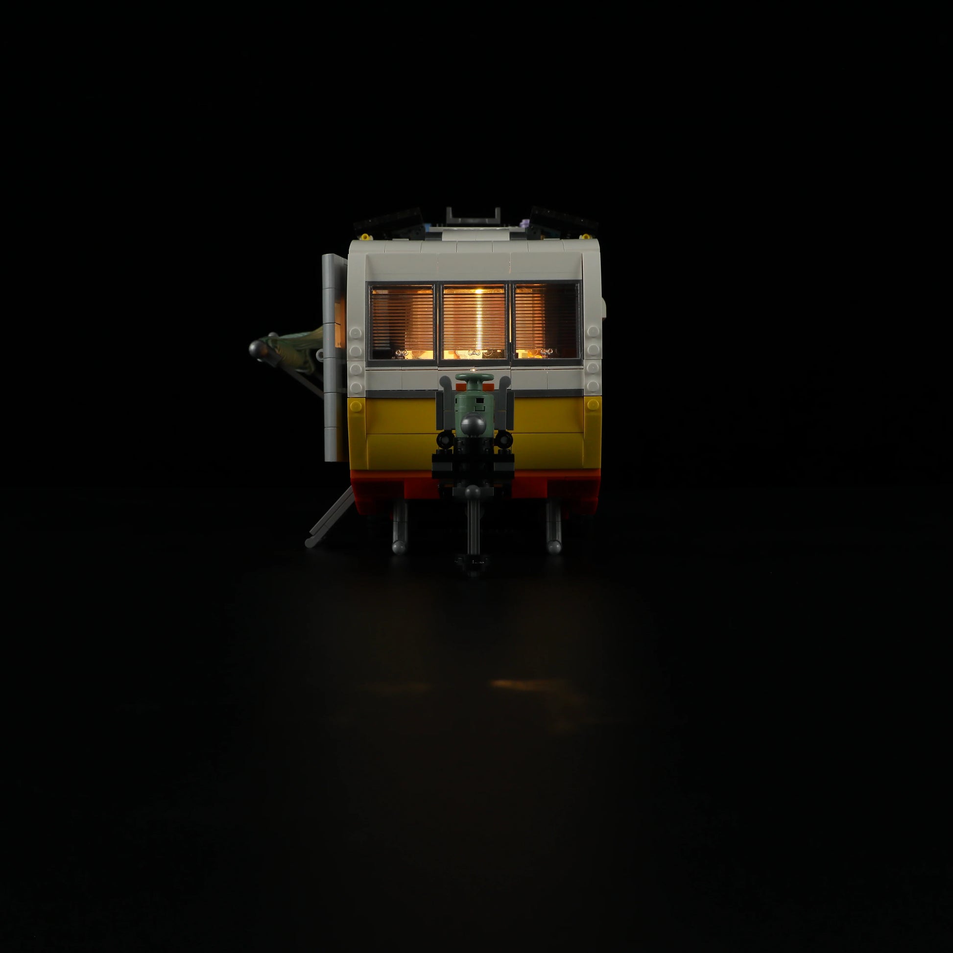 Lumibricks F9032 Travel Trailer rear night view with illuminated windows and detailed hitch assembly