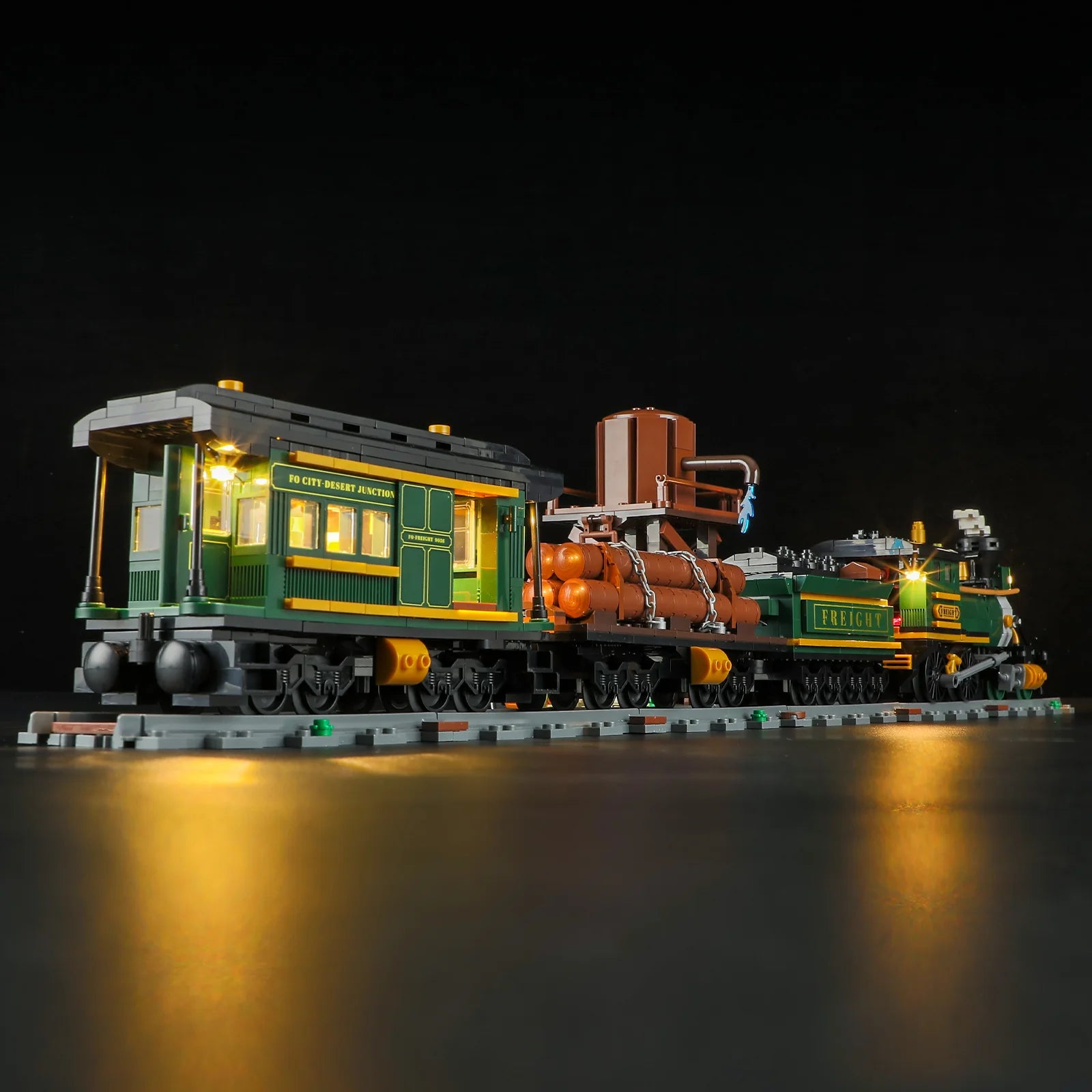 Lumibricks (Formerly Funwhole) F9036 Western Freight Train close-up of illuminated passenger car, log car, and water tower