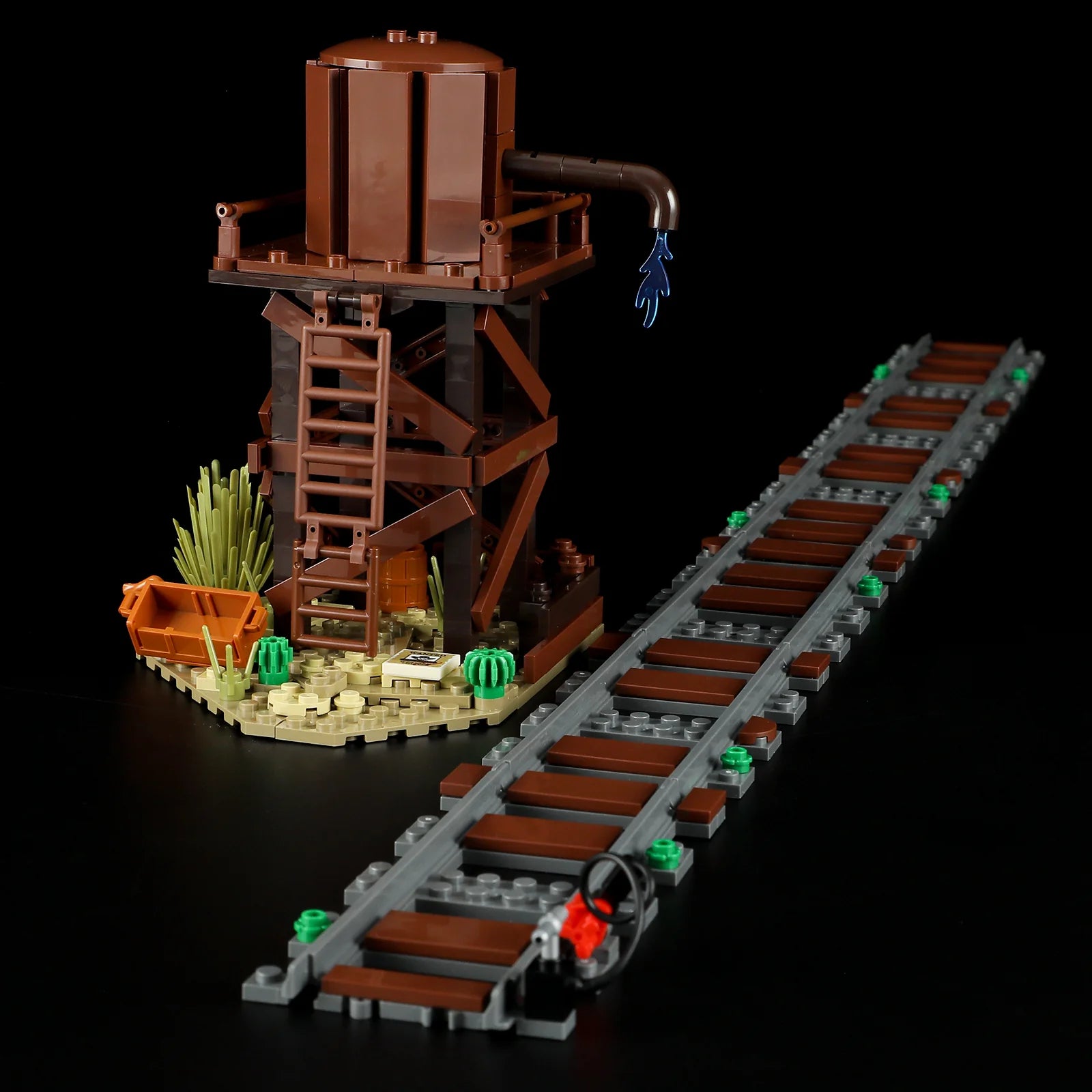 Lumibricks (Formerly Funwhole) F9036 Western Freight Train water tower with ladder, desert landscaping, and railroad track section