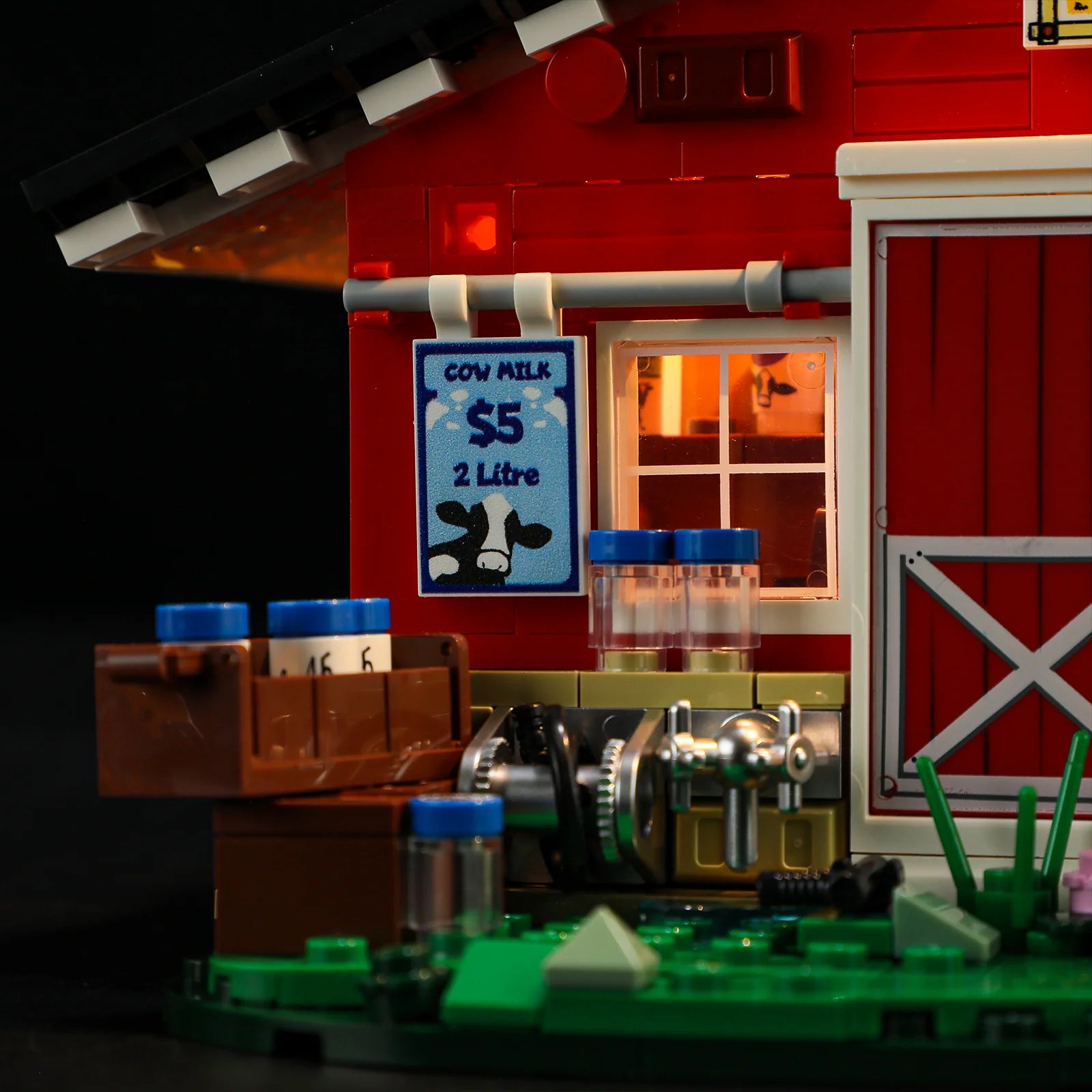 Lumibricks F9037 Cow Barn close-up of milking station with $5 cow milk sign, milk bottles, and barn window glowing at night