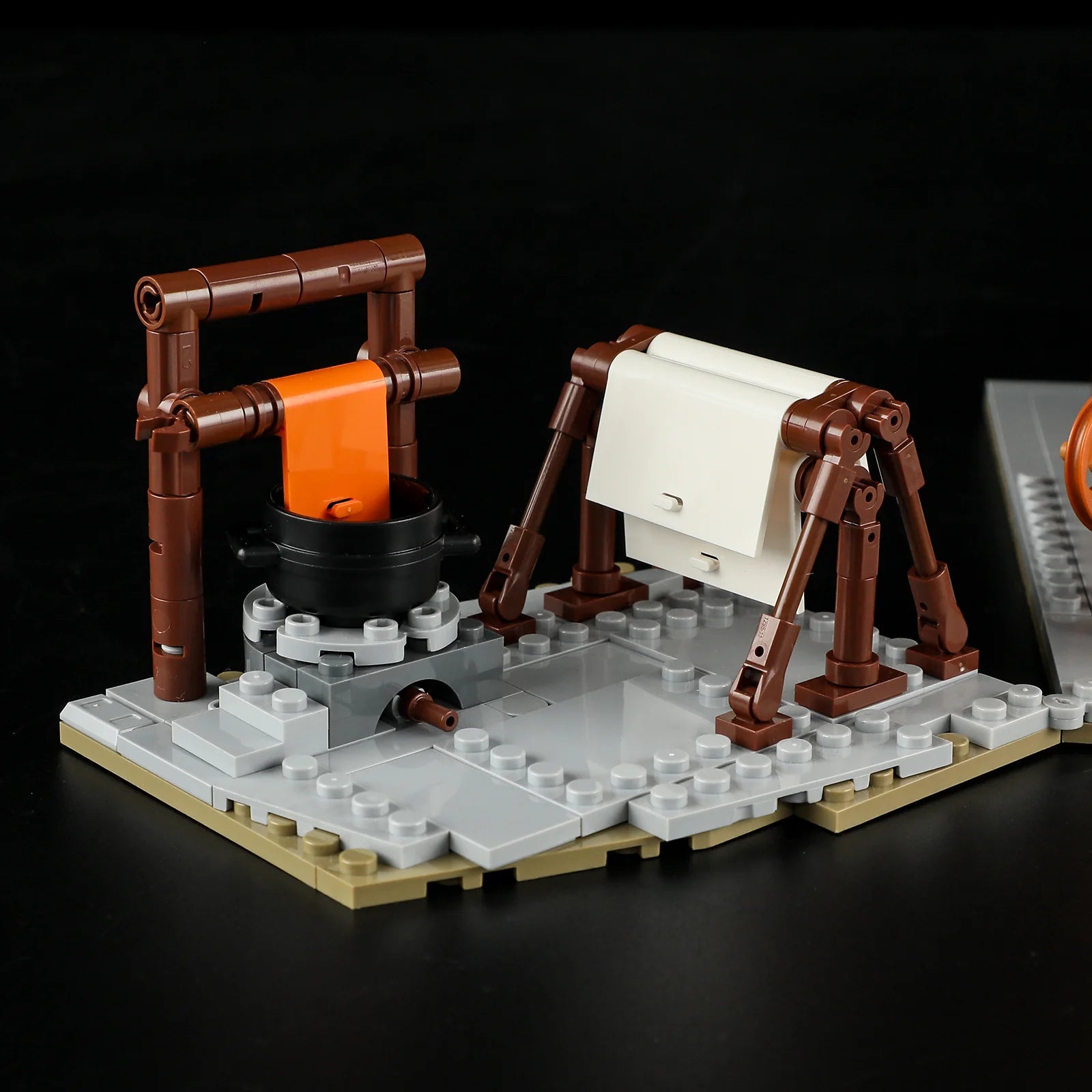 Lumibricks F9038 Medieval Tailor Shop fabric dyeing and drying station with cauldron and stretched cloth outdoors