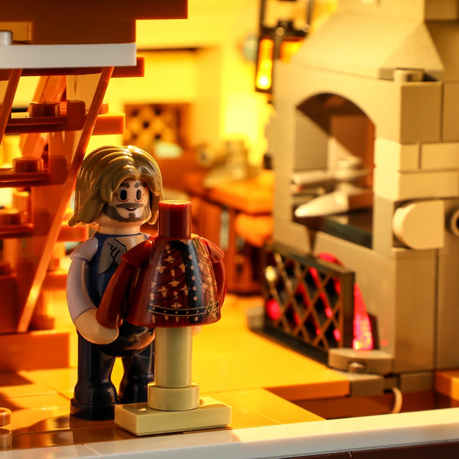 Lumibricks F9038 Medieval Tailor Shop interior with tailor minifigure, detailed mannequin, and illuminated fireplace