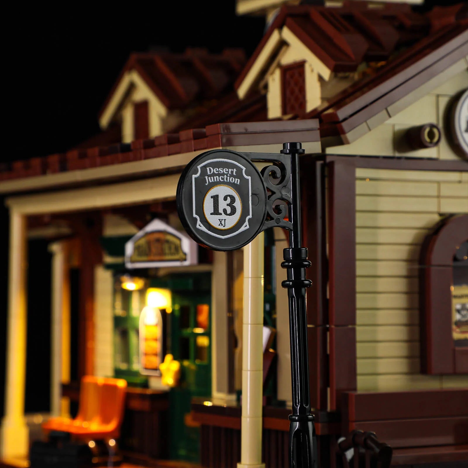 Lumibricks (formerly Funwhole) F9039 Western Train Station close-up of Desert Junction 13 signpost and station facade.