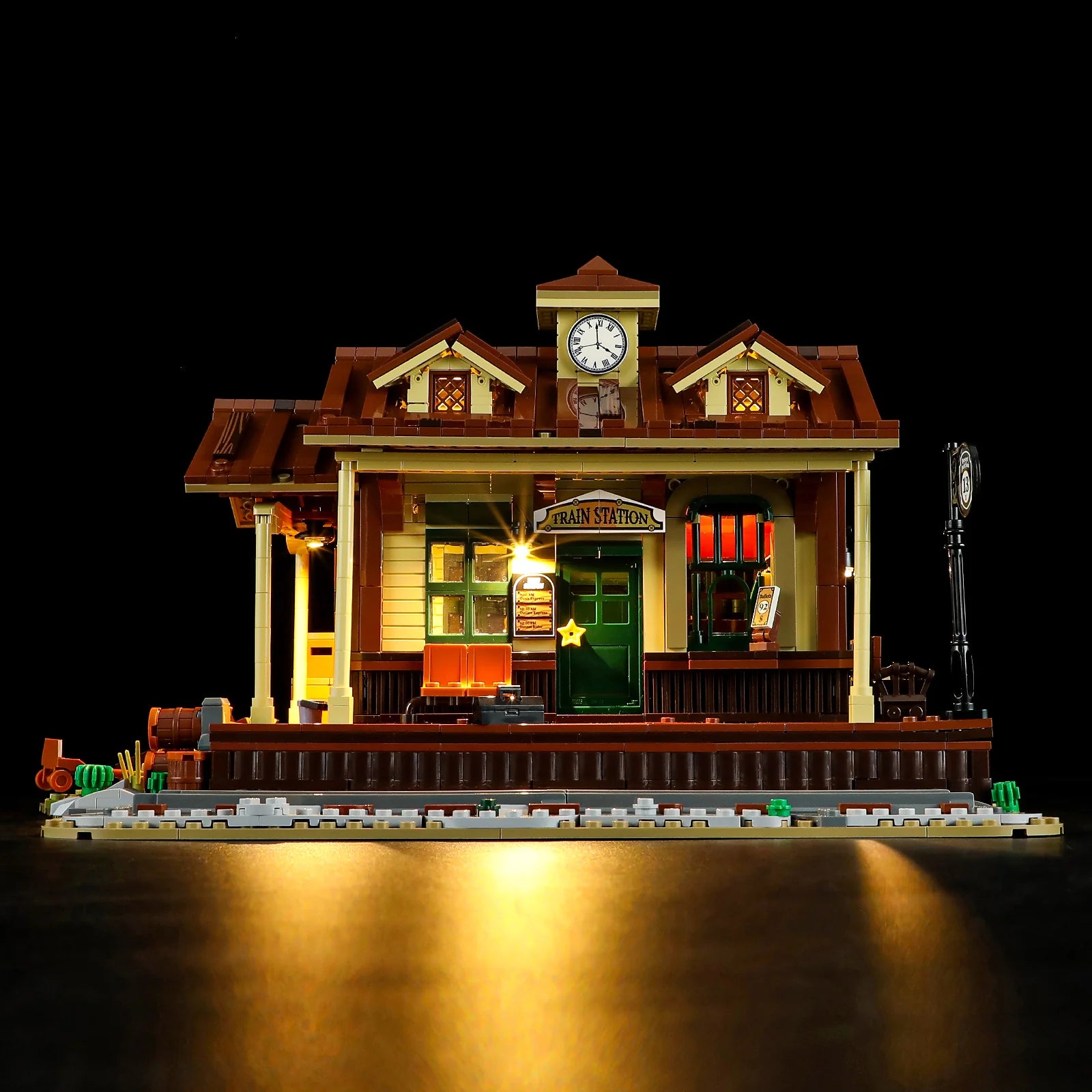 Lumibricks (formerly Funwhole) F9039 Western Train Station front view with lights on, detailed platform and clock tower.
