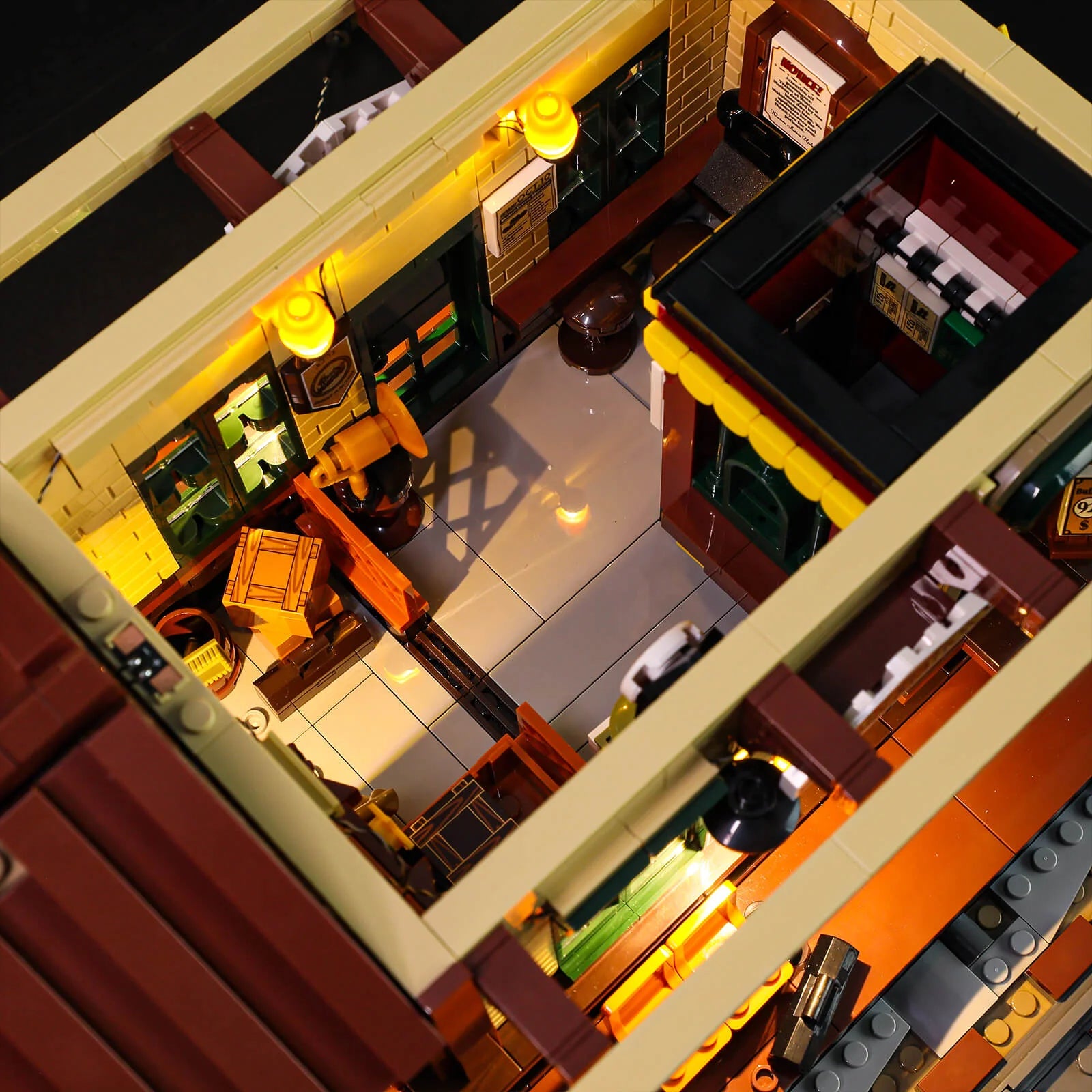 Lumibricks (formerly Funwhole) F9039 Western Train Station interior top view showing lighted waiting area and ticket counter.