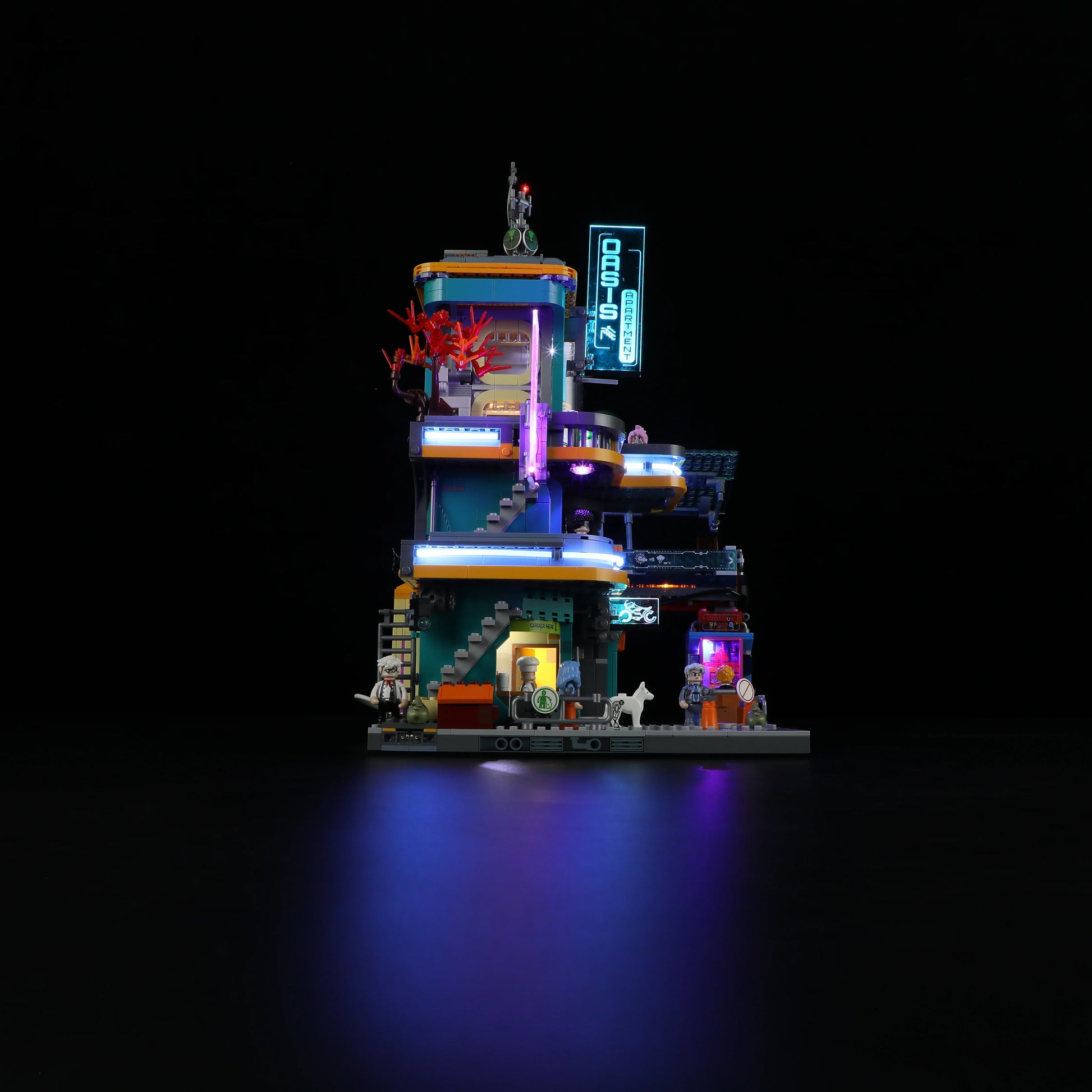 Lumibricks (Formerly Funwhole) F9042 Cyberpunk Apartment night side view with illuminated neon signs, futuristic details, and minifigures