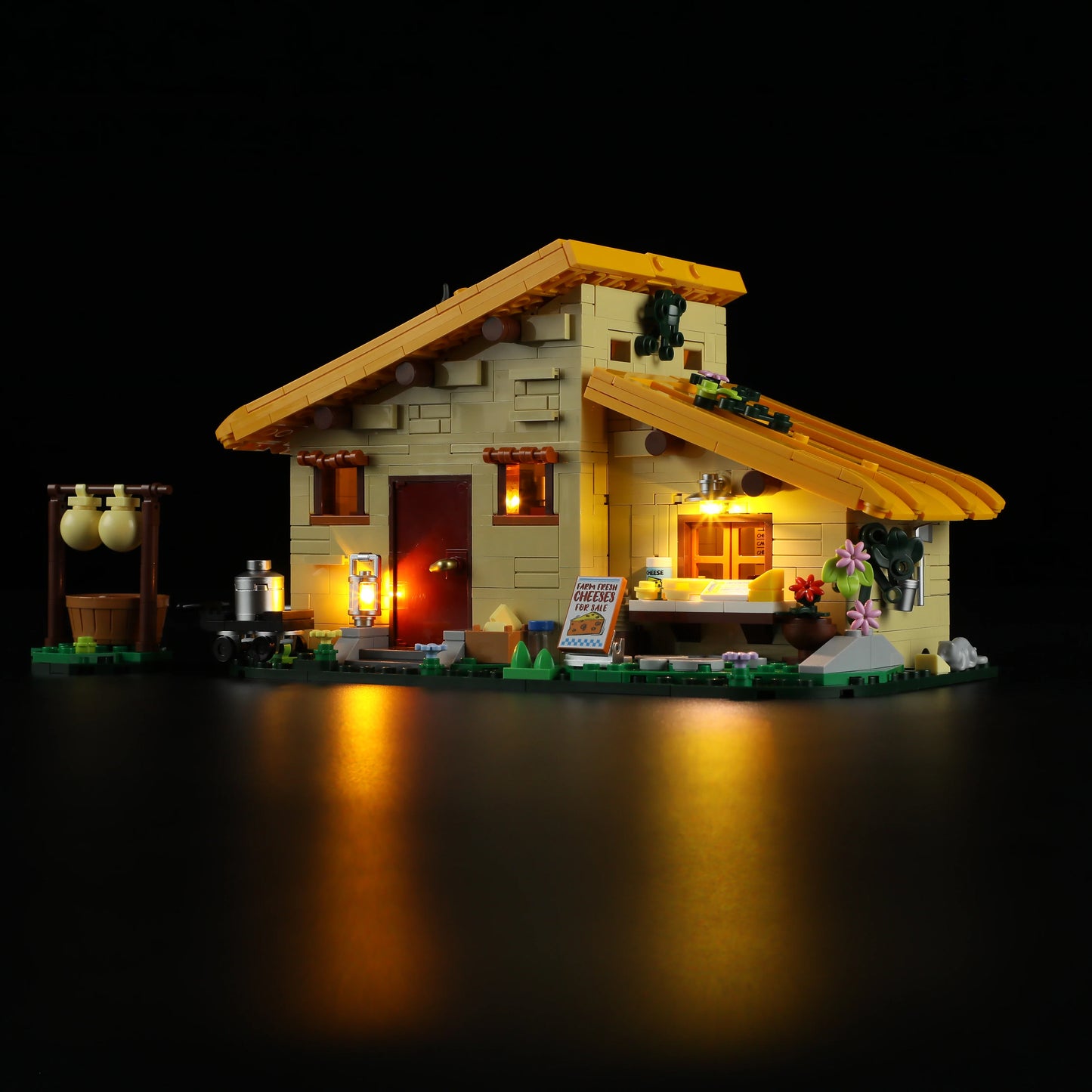 Lumibricks (Formerly Funwhole) F9049 Farm Cheese House at night with illuminated windows, glowing lanterns, and detailed farmhouse scene