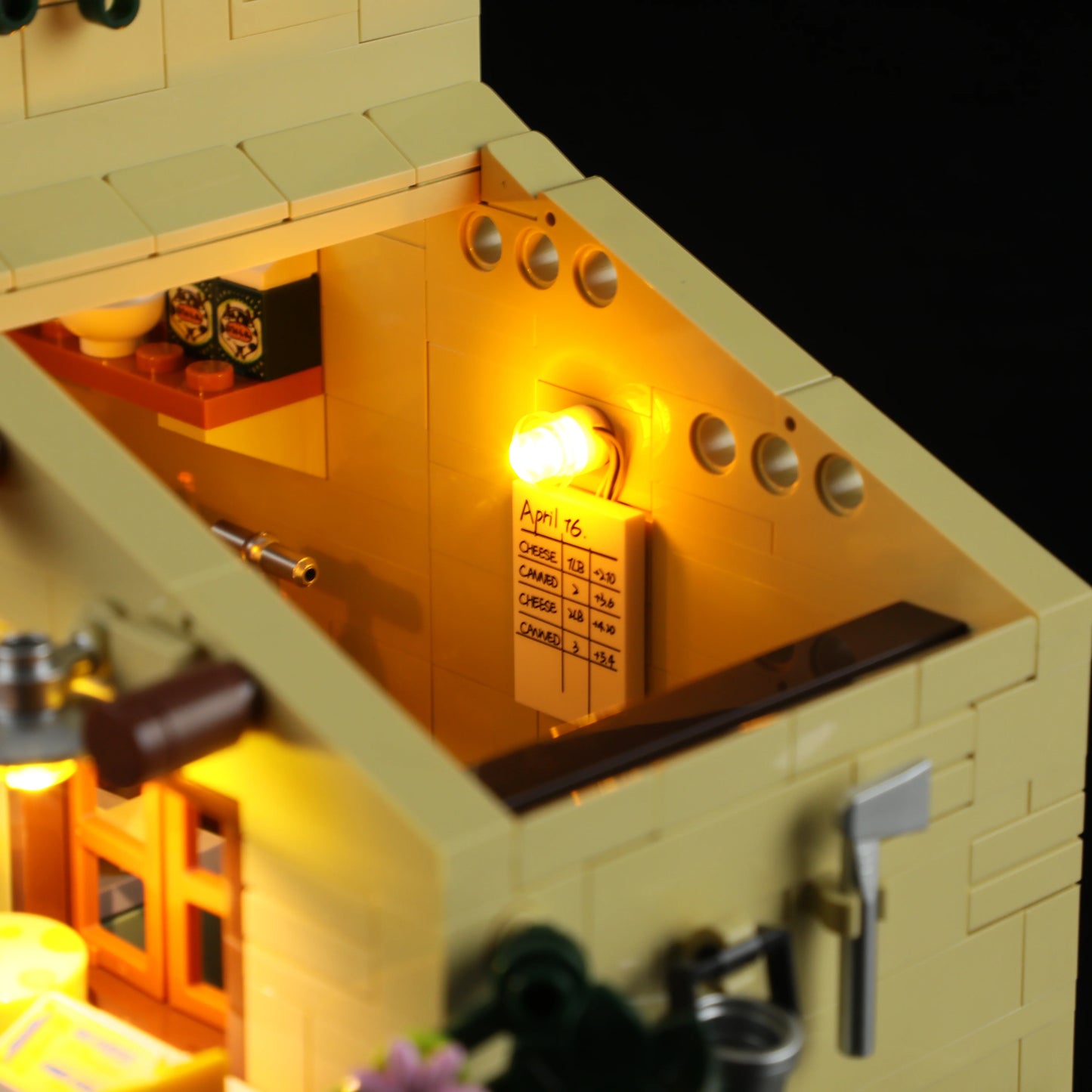 Lumibricks (Formerly Funwhole) F9049 Farm Cheese House interior with illuminated wall chart, kitchen utensils, and axe on wall
