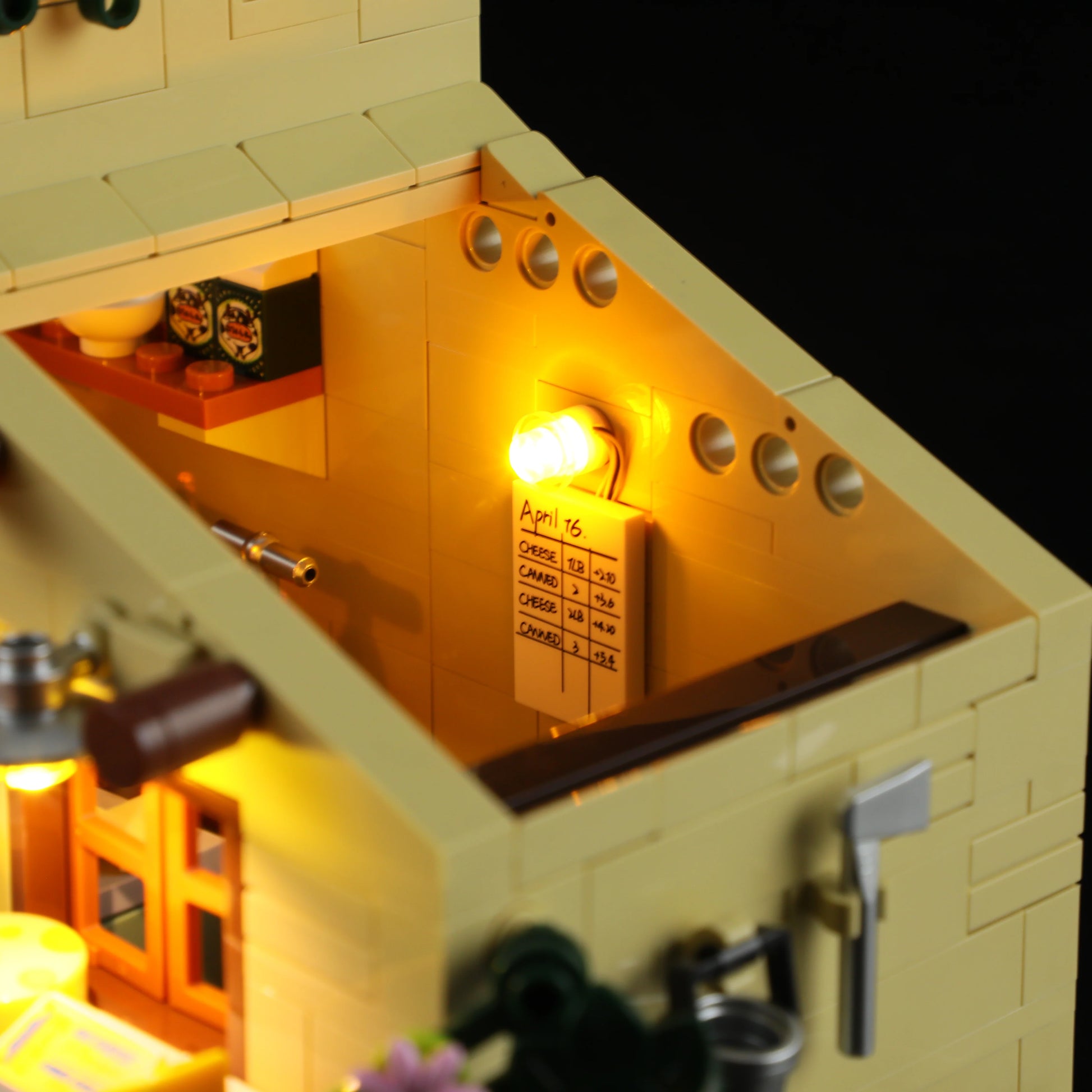 Lumibricks (Formerly Funwhole) F9049 Farm Cheese House interior with illuminated wall chart, kitchen utensils, and axe on wall