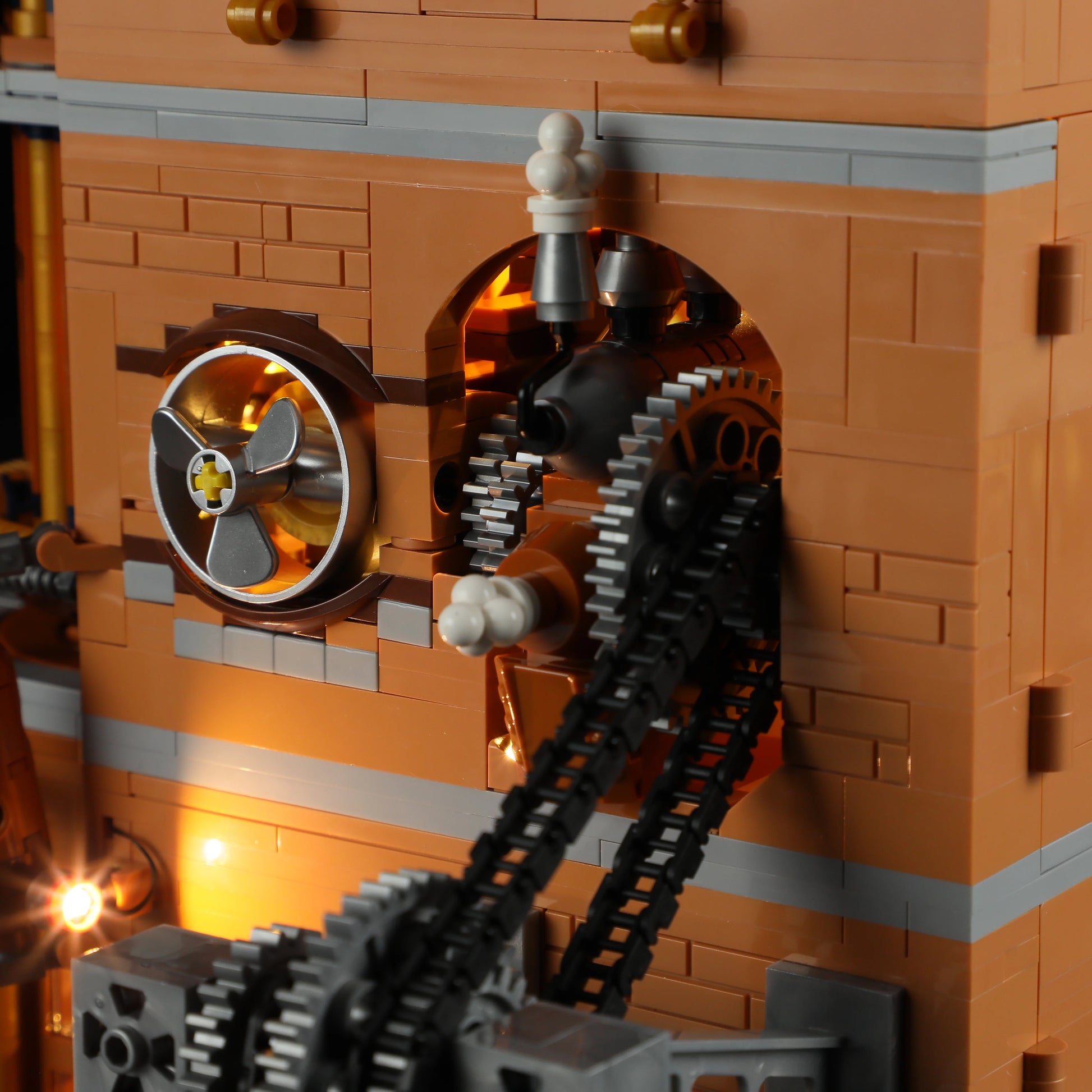 Lumibricks F9050 Steampunk Flying Club close-up of illuminated gears, propeller, and mechanical chain on Victorian-style wall