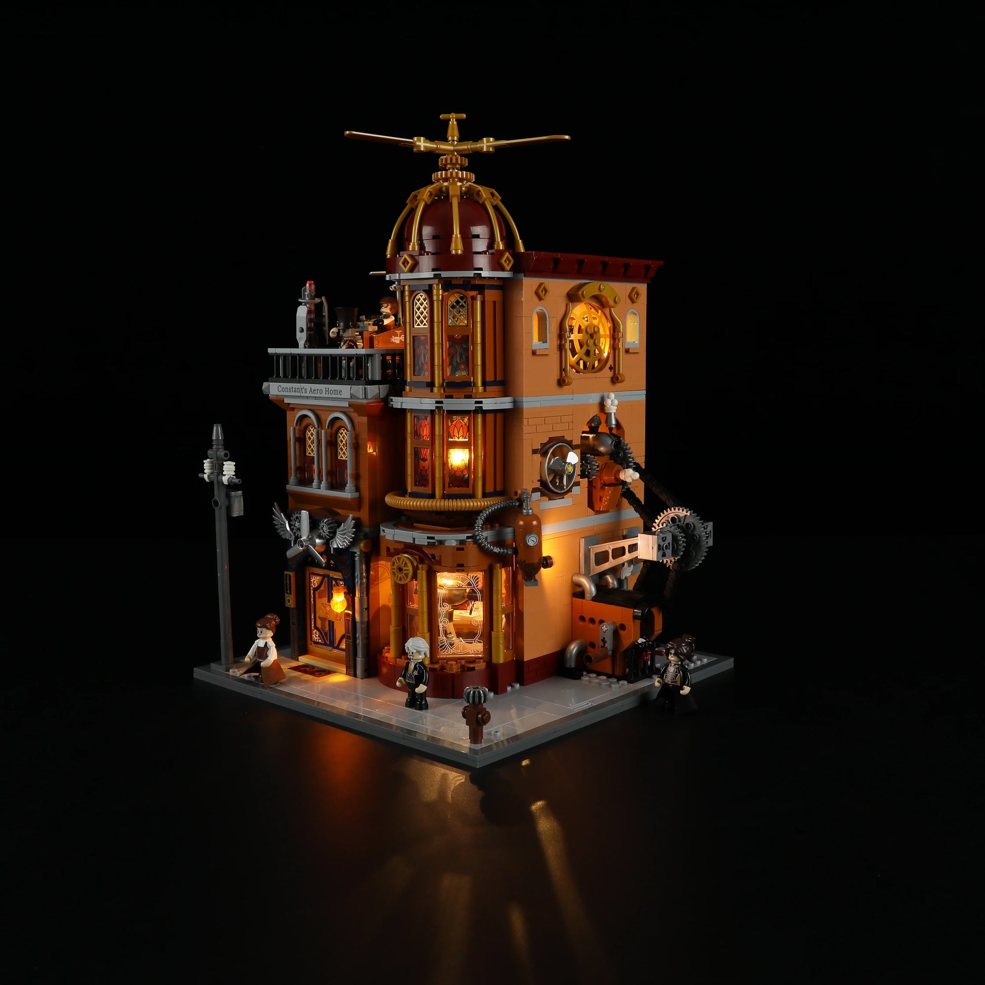 Lumibricks F9050 Steampunk Flying Club at night with illuminated windows, gears, rooftop propeller, and minifigures in steampunk scene