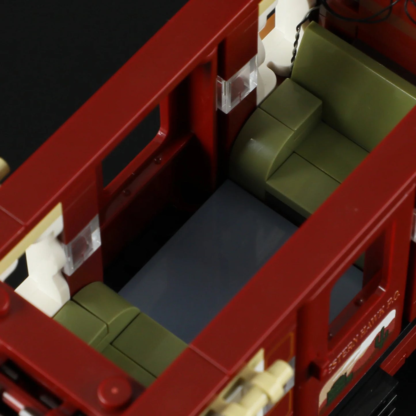 Lumibricks F9052 Western Stagecoach interior showing green seats, windows, and detailed coach design