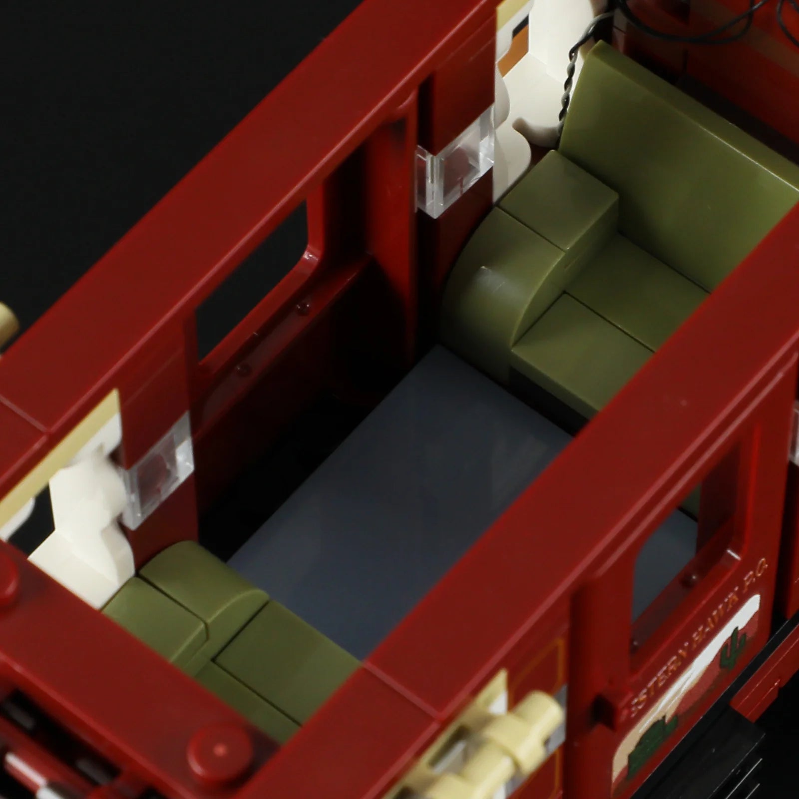 Lumibricks F9052 Western Stagecoach interior showing green seats, windows, and detailed coach design