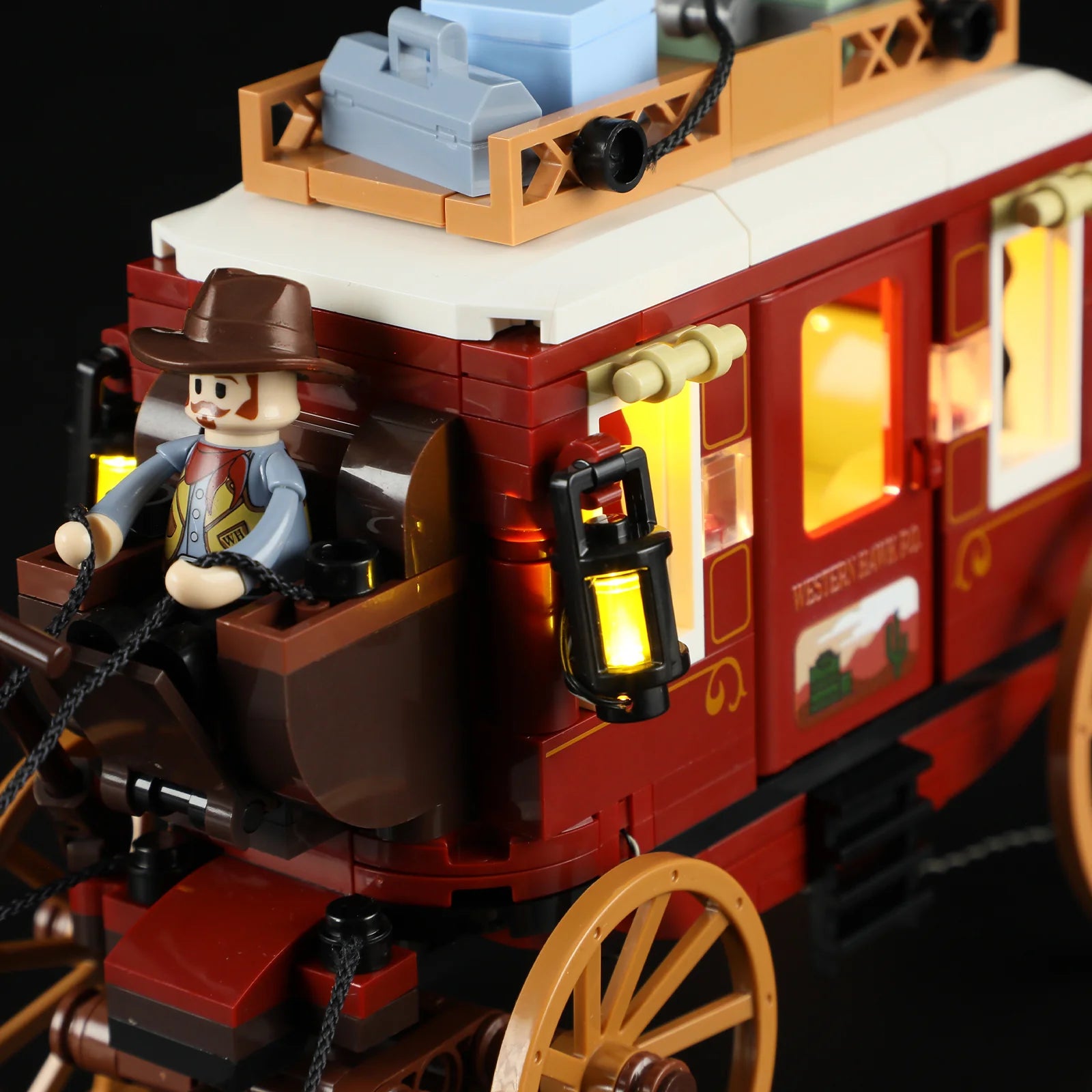 Lumibricks F9052 Western Stagecoach cowboy minifigure in foreground with horses and illuminated stagecoach in background