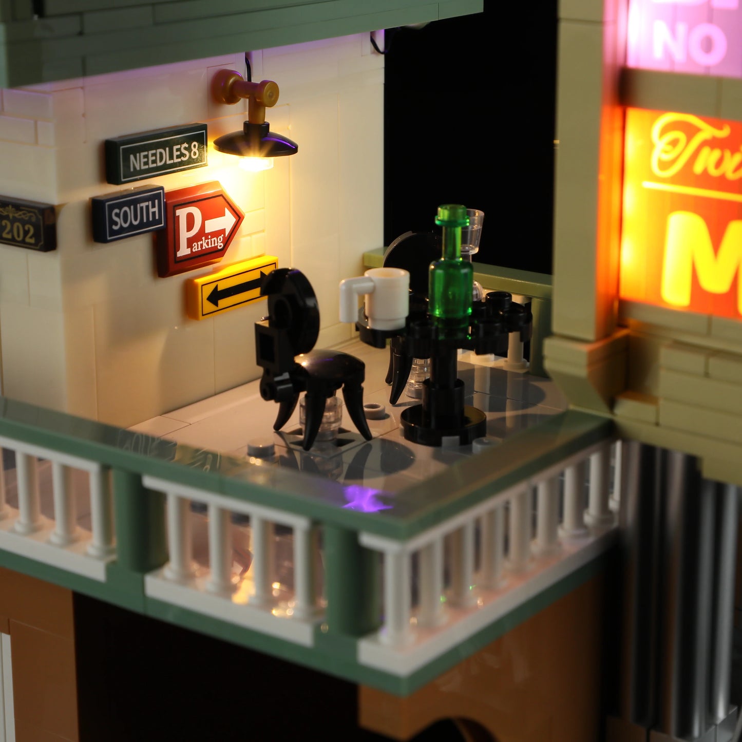 Lumibricks (Formerly Funwhole) F9054 Twilight Motel balcony with glowing lamp, parking signs, round table, and drink accessories