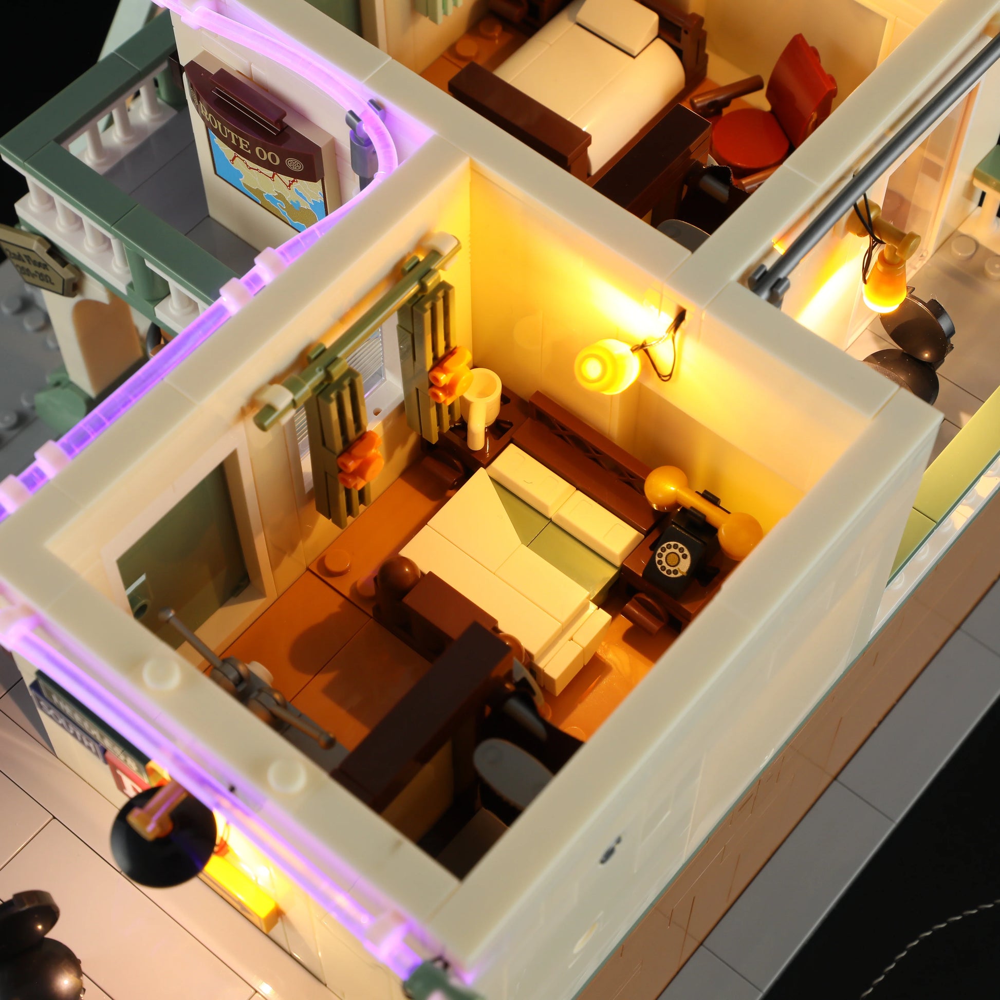 Lumibricks (Formerly Funwhole) F9054 Twilight Motel illuminated bedroom interior with bed, vintage phone, and detailed furnishings