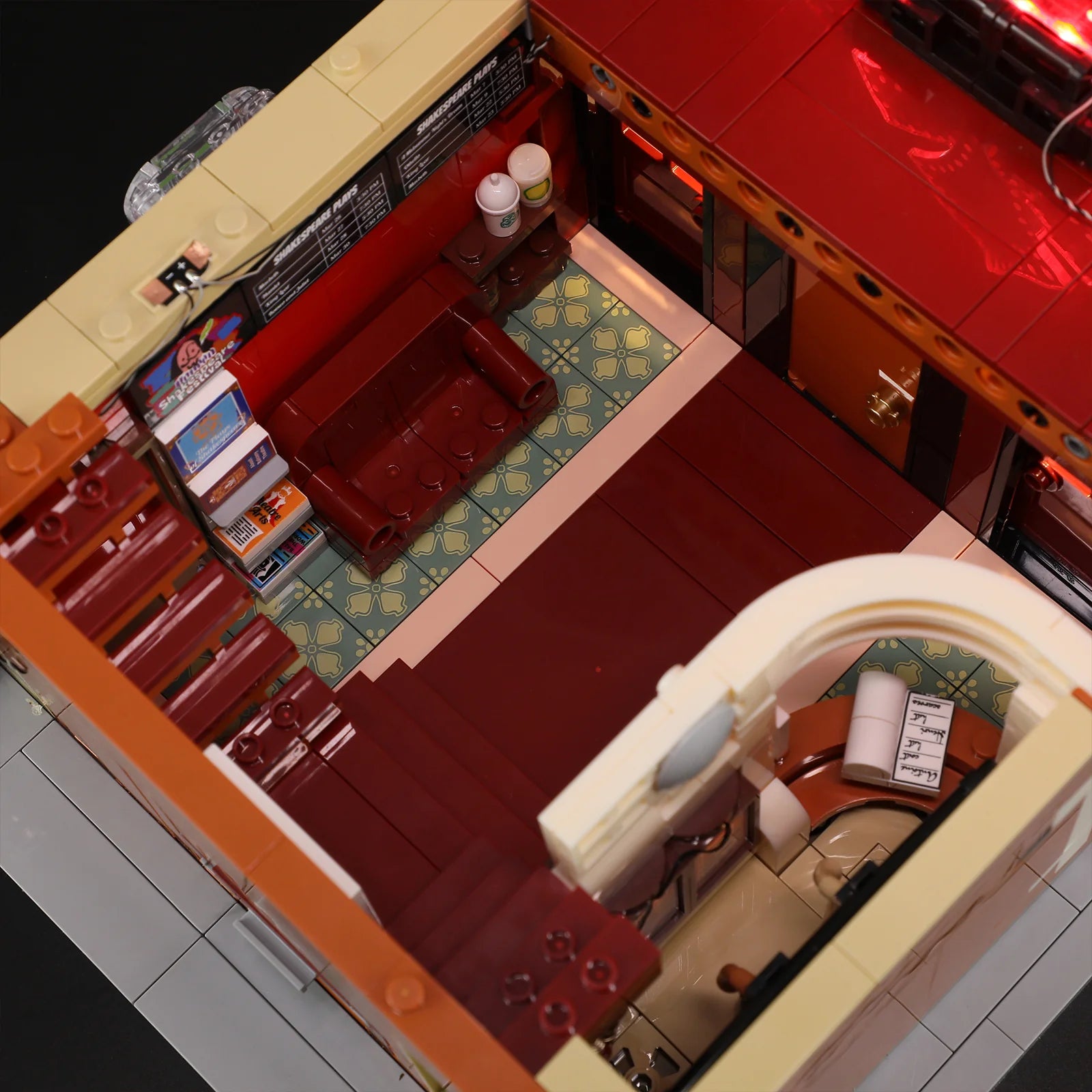 Lumibricks (Formerly Funwhole) F9056 Balcony Theatre interior lobby with lit waiting area, red sofa, ticket stand, and tiled floor
