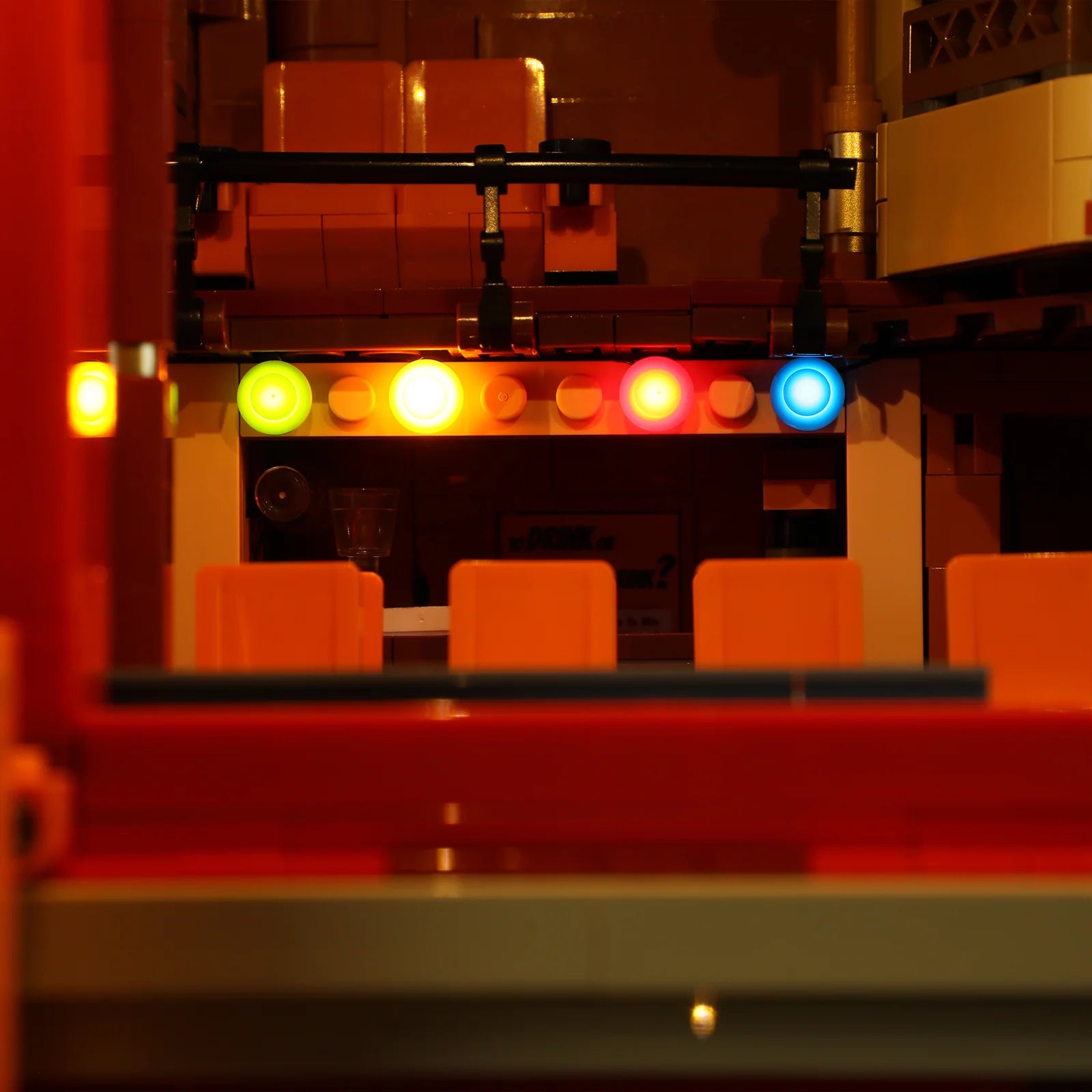 Lumibricks (Formerly Funwhole) F9056 Balcony Theatre stage view with colorful LED spotlights and orange tiered seating