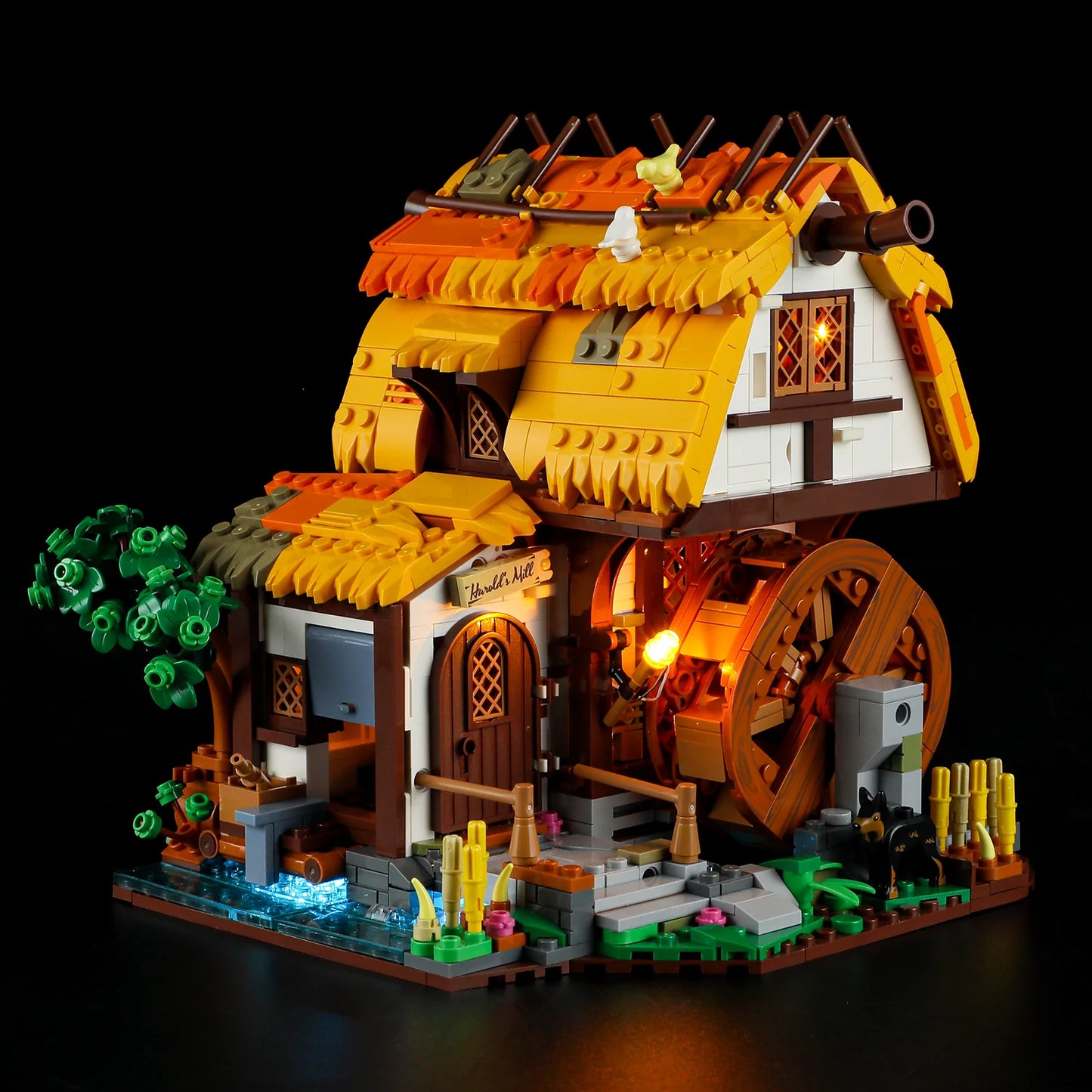 Lumibricks (Formerly Funwhole) F9061 Medieval Water Mill with LED lights on and off, illuminated windows, and detailed mill exterior