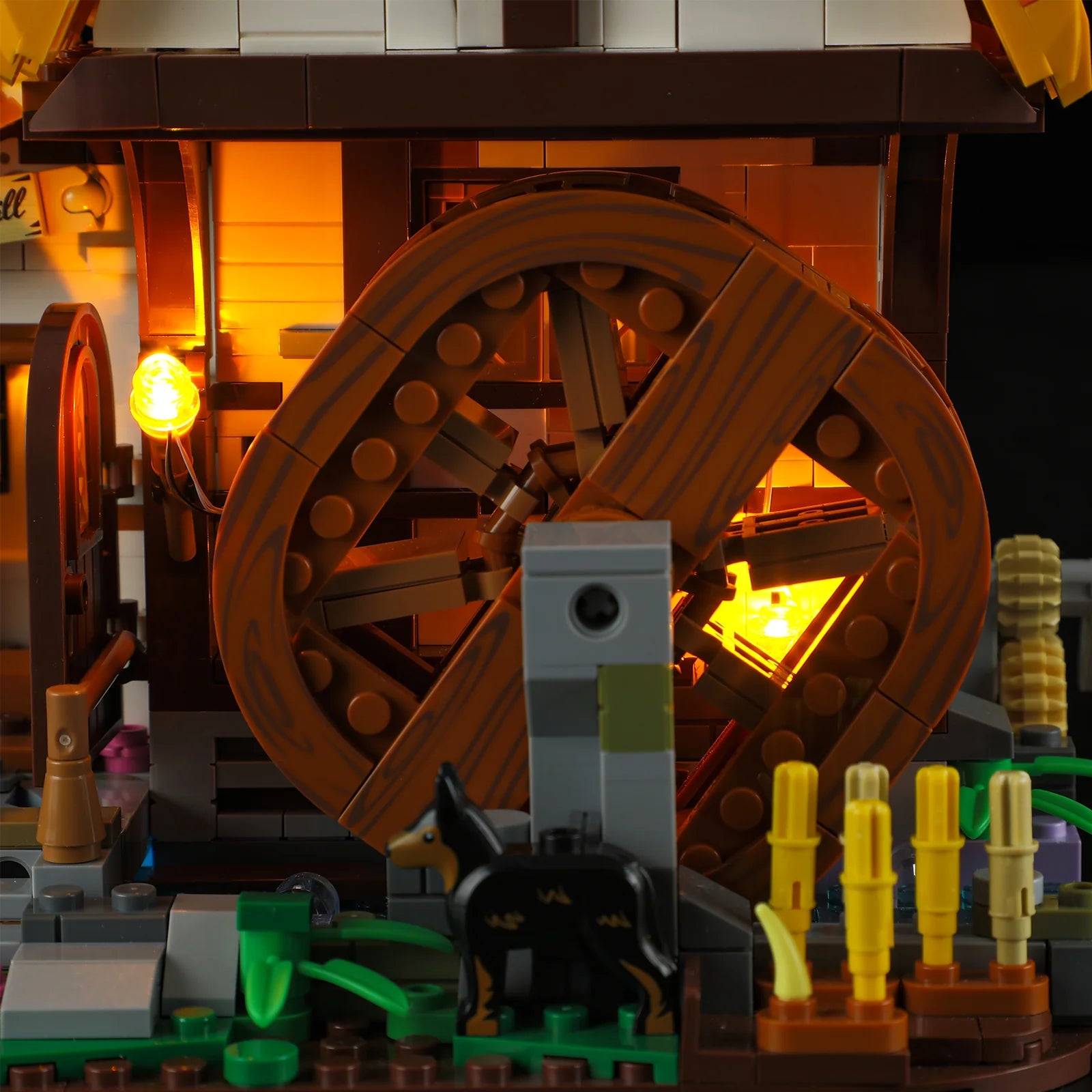 Lumibricks (Formerly Funwhole) F9061 Medieval Water Mill close-up of illuminated waterwheel, golden crops, and black dog figure