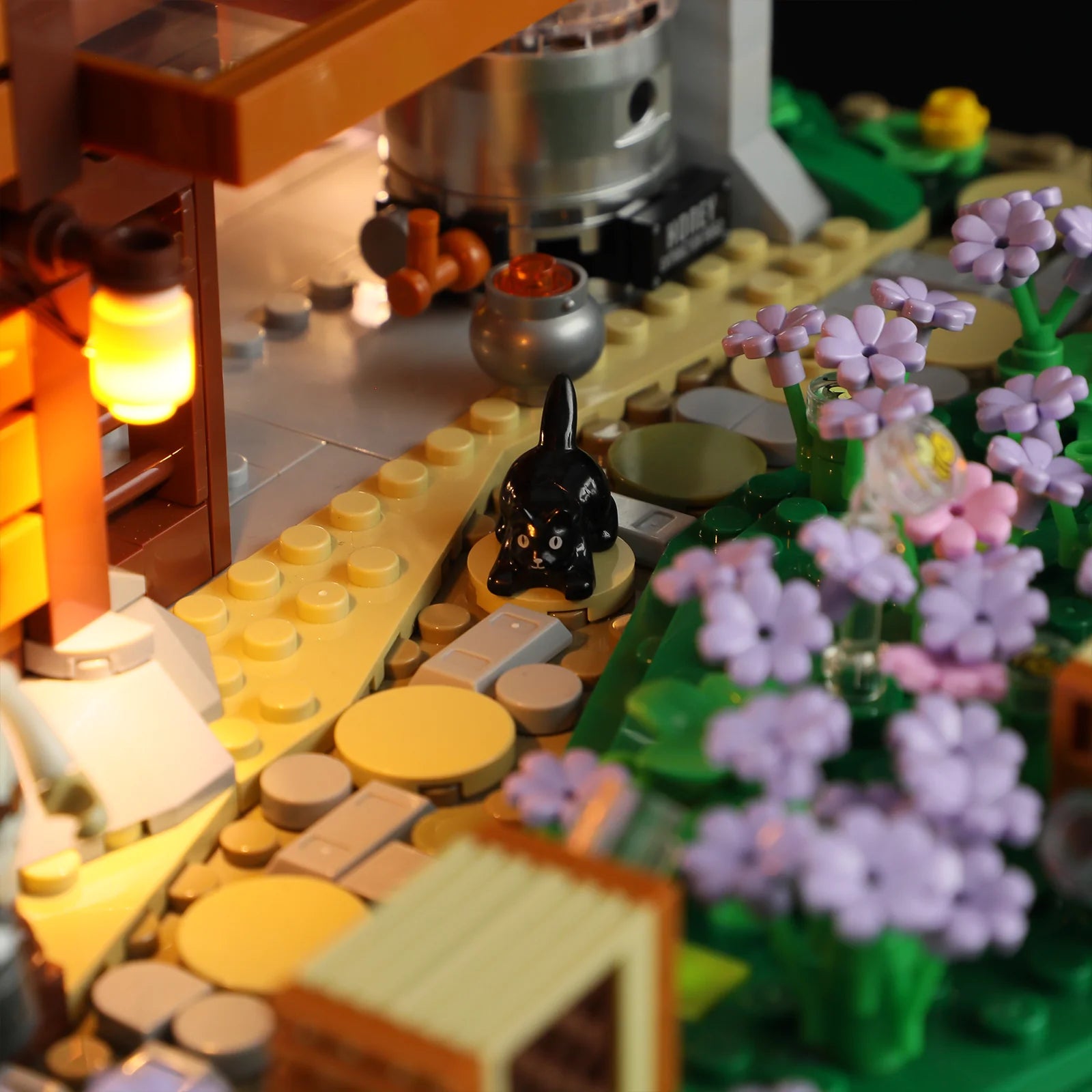 Lumibricks (Formerly Funwhole) F9062 Bee Farm close-up of black cat on garden path with glowing lantern and blooming flowers