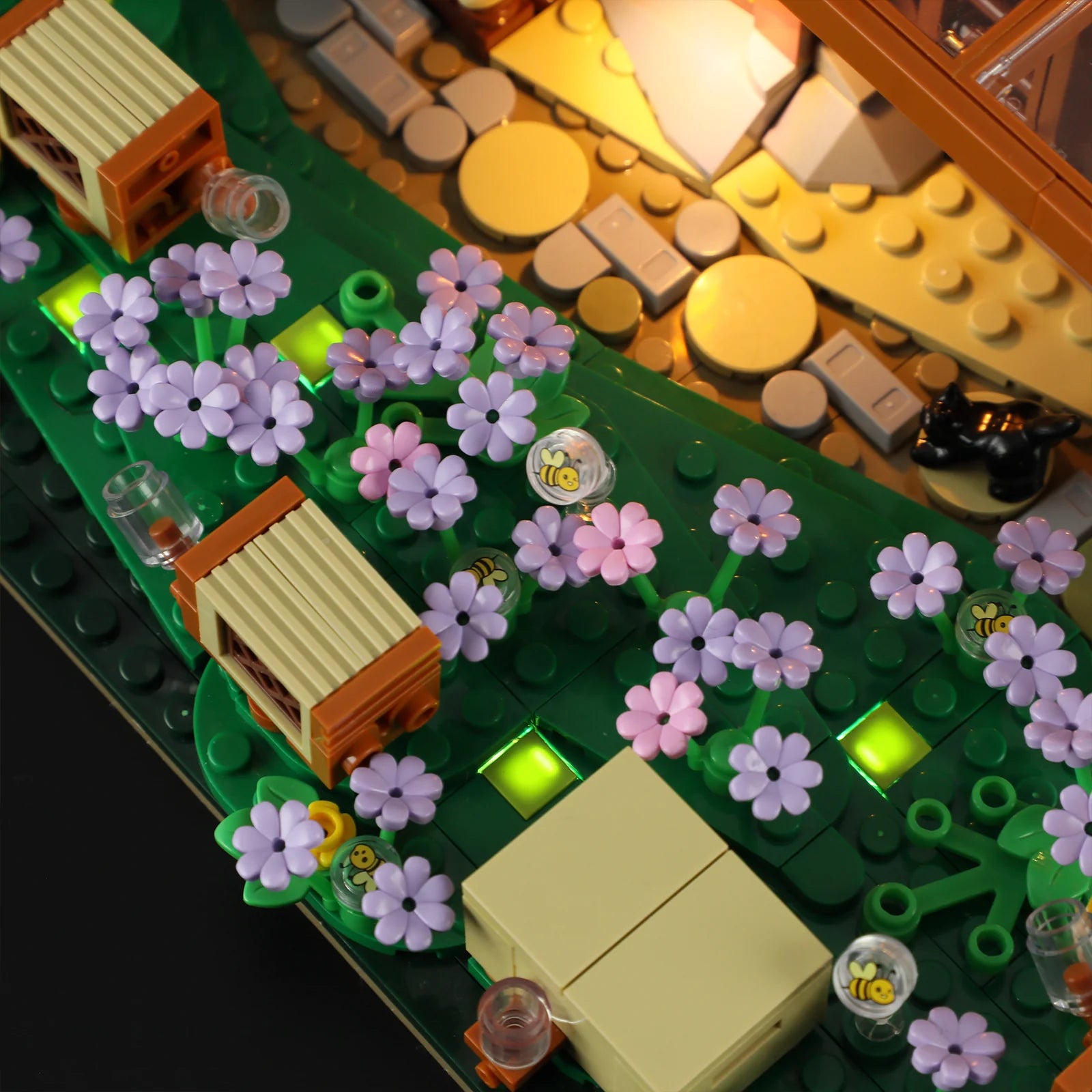 Lumibricks (Formerly Funwhole) F9062 Bee Farm close-up of illuminated flower garden, beehives, and bee-printed clear domes