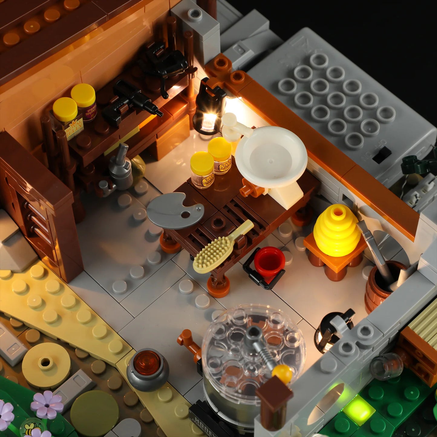 Lumibricks (Formerly Funwhole) F9062 Bee Farm honey workshop interior with illuminated jars, honeycomb tools, and beehive details