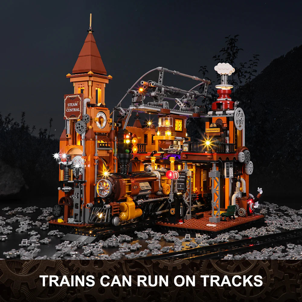 Lumibricks F9007 Steampunk Train Station at night with illuminated train on tracks, clock tower, and glowing gears