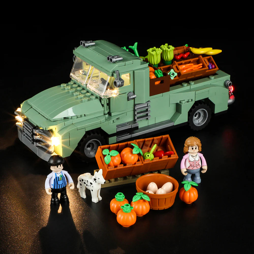 Lumibricks F9016 Farm Truck with headlights on, minifigures, dog, pumpkins, eggs, and vegetable crates